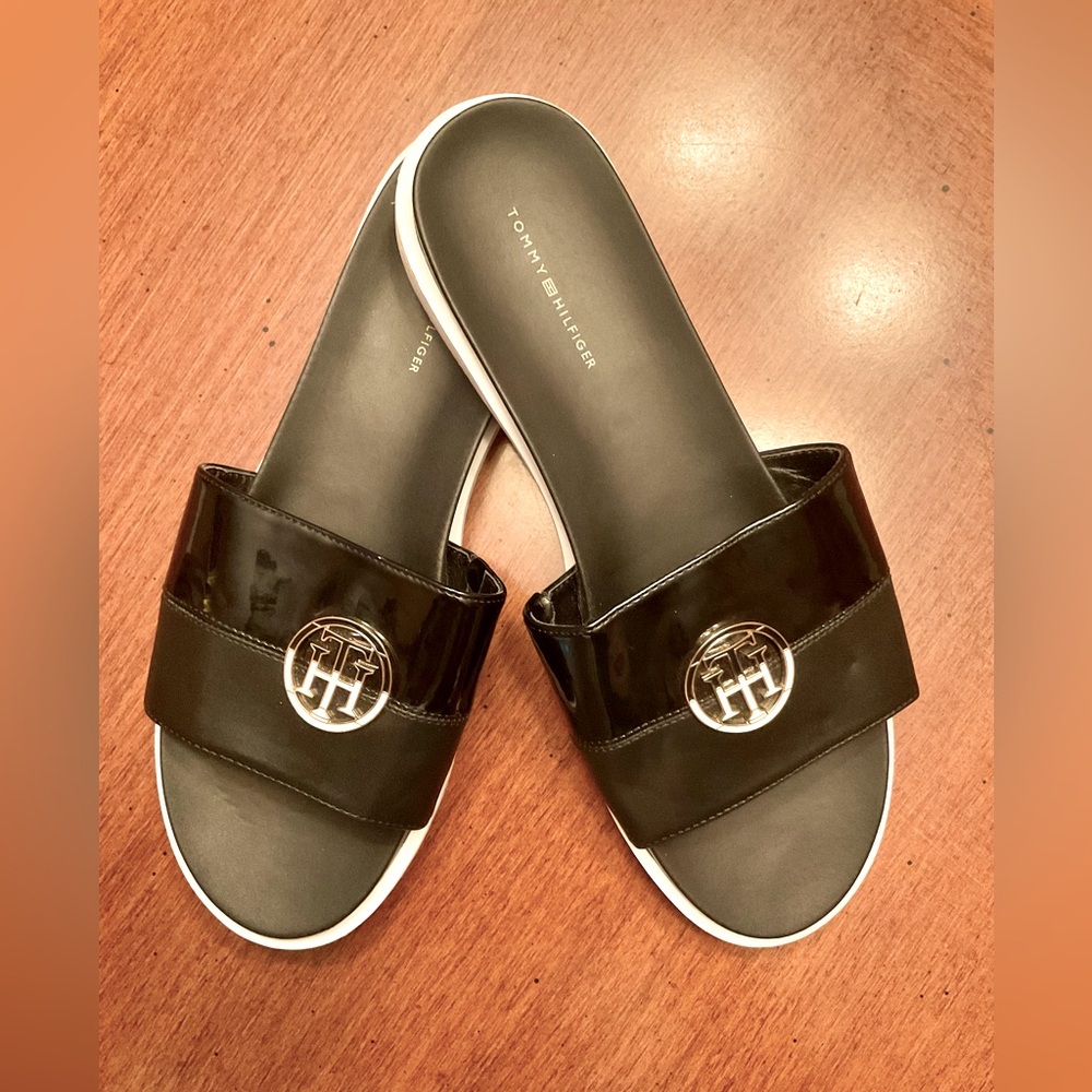 Tommy Hilfiger Never been worn black slides with black/cream/gold emblem.
